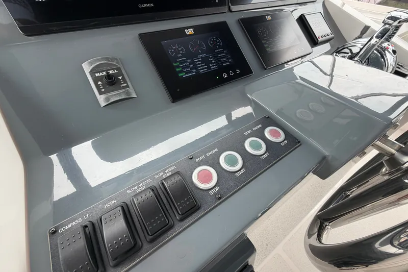 Slide: The Image of Control panel of a 2020 Horizon E56 yacht with navigation and engine controls. - 88