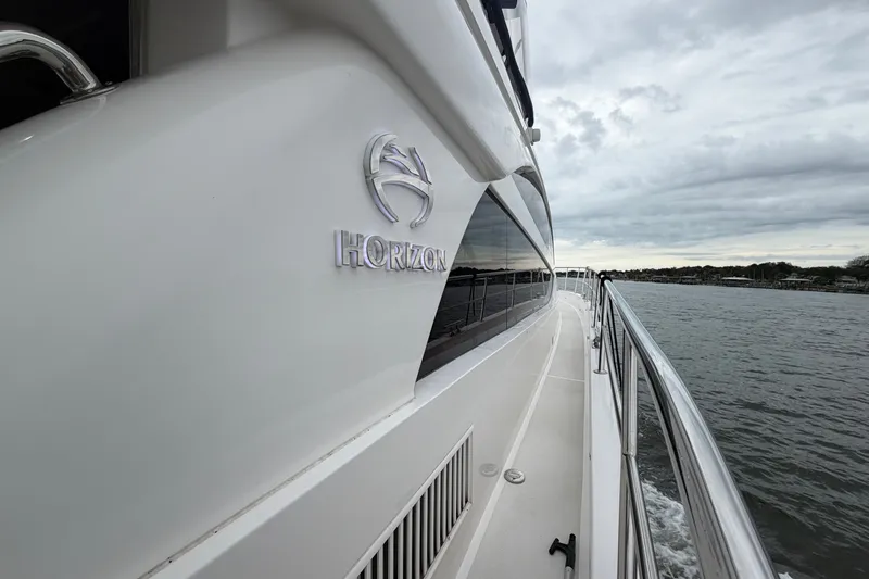 Slide: The Image of Luxury Horizon E56 yacht cruising on a cloudy day, 2020 model. - 20