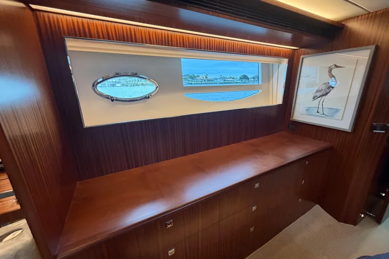 Slide: The Image of Luxurious interior of 2020 Horizon E56 yacht with wood finish and scenic window view. - 55