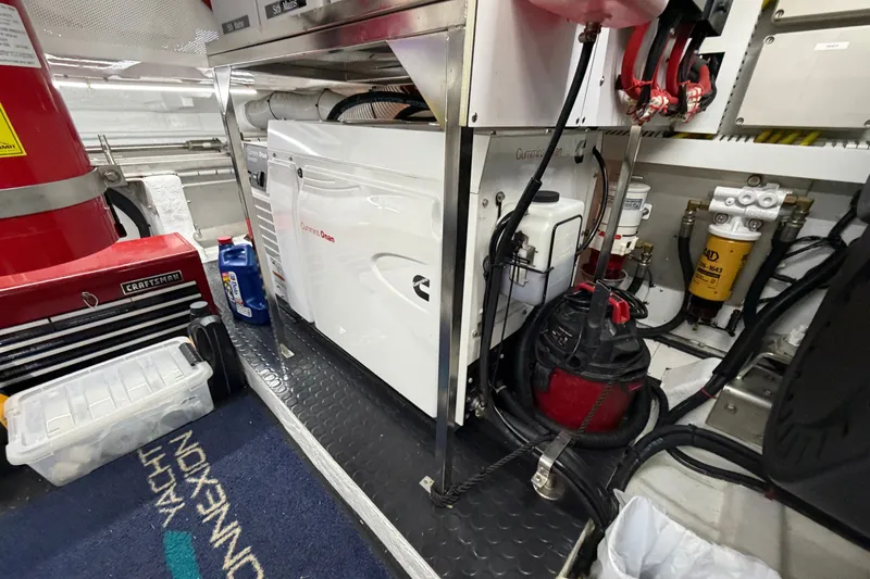 Slide: The Image of Engine room of a 2020 Horizon E56 yacht with Cummins Onan generator and Craftsman toolbox. - 92