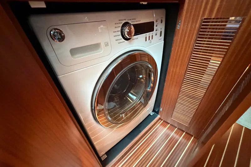 Slide: The Image of Front-loading washing machine in wooden cabinet, Horizon E56, 2020 model. - 63