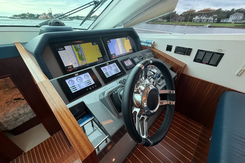 Slide: The Image of Cockpit of 2020 Horizon E56 yacht with advanced navigation displays and steering wheel. - 33