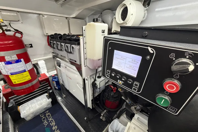 Slide: The Image of Engine room of 2020 Horizon E56 yacht with control panel and fire extinguisher. - 91
