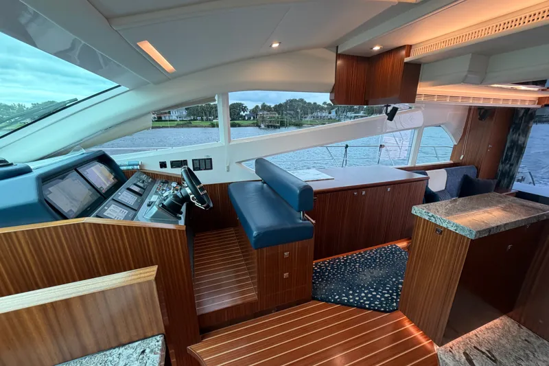 Slide: The Image of Luxurious interior of 2020 Horizon E56 yacht with modern helm and elegant wood finishes. - 32