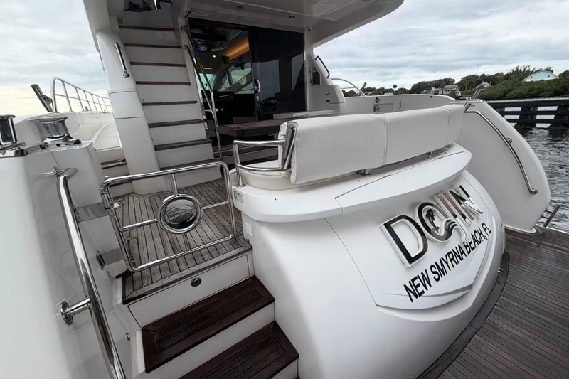 Slide: The Image of Luxury Horizon E56 yacht, 2020 model, docked with elegant wooden deck and sleek design. - 16