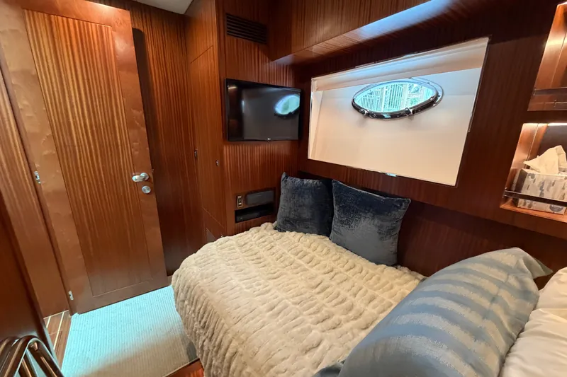 Slide: The Image of Luxurious cabin interior of 2020 Horizon E56 yacht with cozy bedding and porthole window. - 73