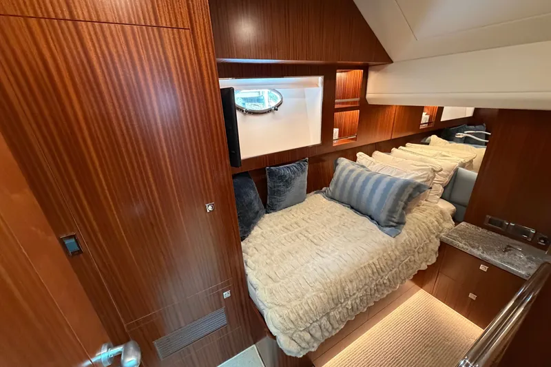 Slide: The Image of Luxurious cabin interior of 2020 Horizon E56 yacht with cozy bedding and wooden finishes. - 72