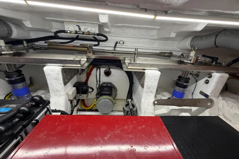 Slide: The Image of Engine room of a 2020 Horizon E56 yacht, showcasing mechanical components and wiring. - 95