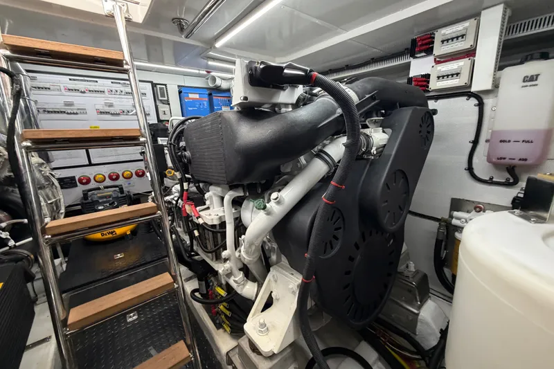 Slide: The Image of Engine room of 2020 Horizon E56 yacht with visible machinery and control panels. - 97