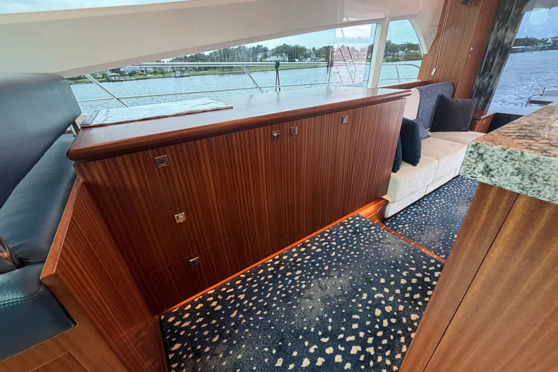 Slide: The Image of Luxurious interior of 2020 Horizon E56 yacht with elegant wood finish and plush seating. - 41