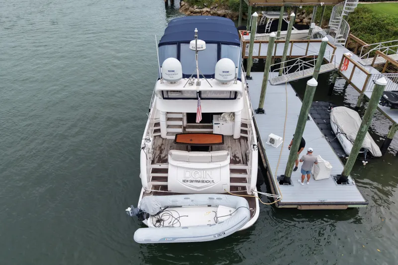Slide: The Image of Aerial view of a 2020 Horizon E56 yacht docked at a marina. - 13