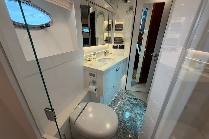 Slide: The Image of Luxurious bathroom interior on a 2020 Horizon E56 yacht, featuring modern fixtures and elegant design. - 69