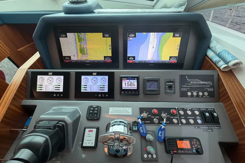 Slide: The Image of Control panel of a 2020 Horizon E56 yacht with navigation and engine displays. - 34