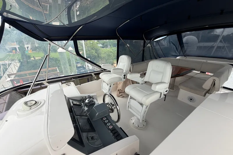 Slide: The Image of Luxurious 2020 Horizon E56 yacht cockpit with white seating and modern controls. - 80
