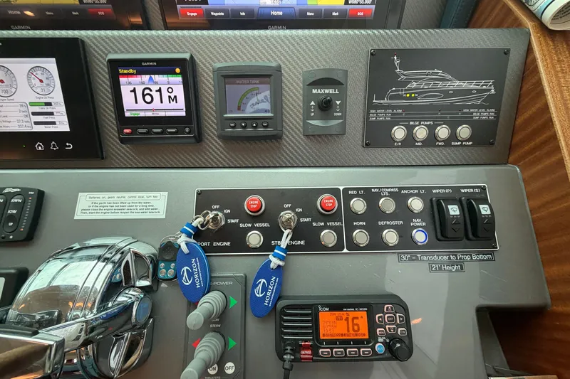 Slide: The Image of Control panel of a 2020 Horizon E56 yacht with navigation and engine controls. - 37