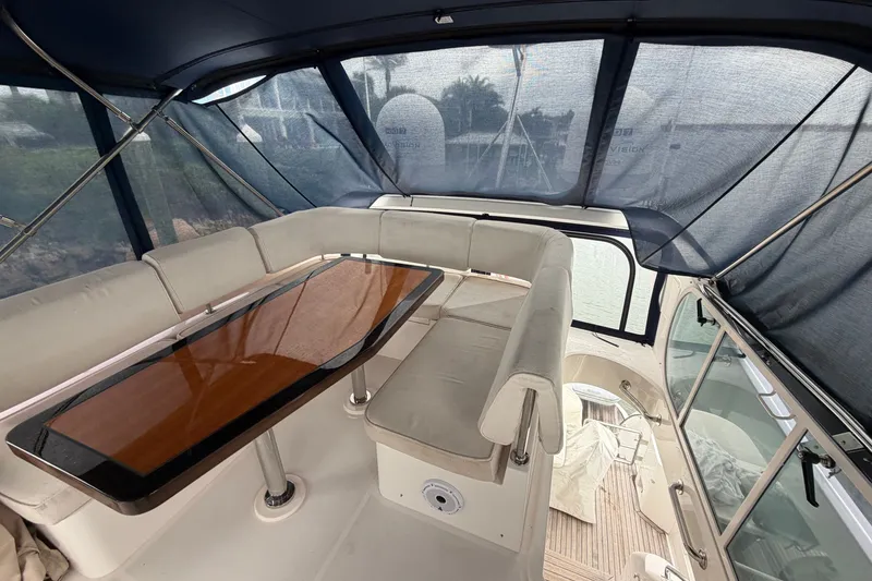 Slide: The Image of Luxurious 2020 Horizon E56 yacht interior with elegant seating and polished wooden table. - 81