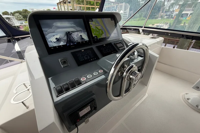 Slide: The Image of Helm of 2020 Horizon E56 yacht with dual displays and navigation controls. - 87