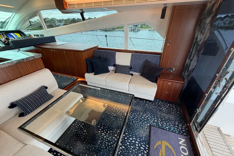Slide: The Image of Luxurious interior of 2020 Horizon E56 yacht with elegant seating and waterfront view. - 28
