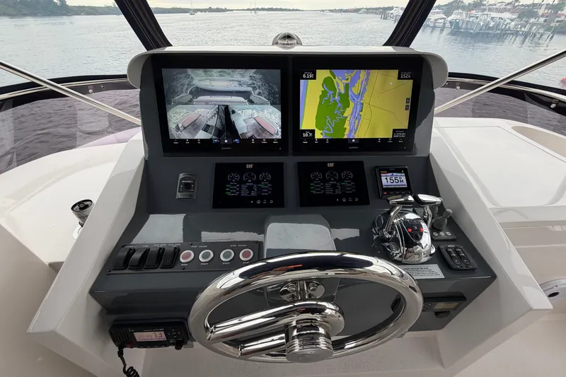 Slide: The Image of Helm of 2020 Horizon E56 yacht with dual navigation screens and controls. - 50