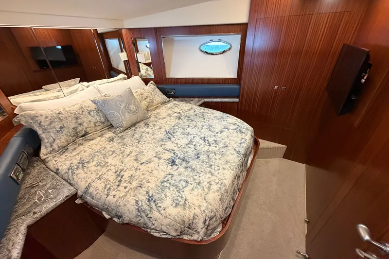 Slide: The Image of Luxurious bedroom interior of 2020 Horizon E56 yacht with elegant bedding and wood paneling. - 76