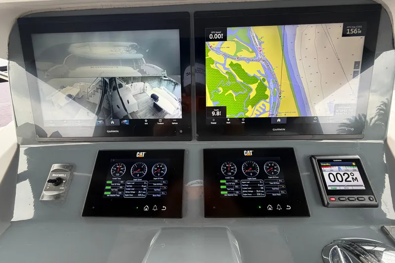 Slide: The Image of Boat dashboard with navigation screens and controls, Horizon E56, 2020 model. - 85