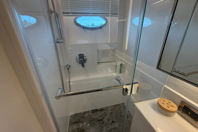 Slide: The Image of Modern shower in 2020 Horizon E56 yacht with glass door and sleek fixtures. - 59