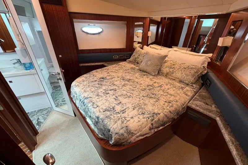 Slide: The Image of Luxurious bedroom interior of 2020 Horizon E56 yacht with elegant bedding and wood accents. - 75