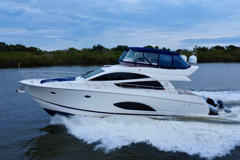 The Image of Luxury Horizon E56 yacht cruising on a serene waterway, 2020 model. - 0