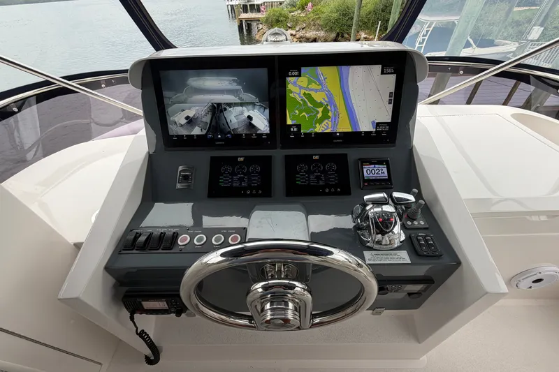 Slide: The Image of Helm of 2020 Horizon E56 yacht with navigation screens and controls. - 84
