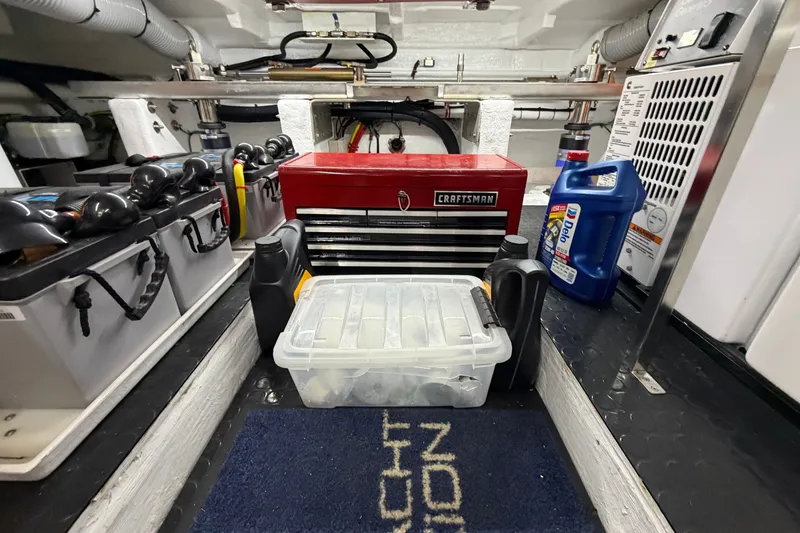 Slide: The Image of Engine room of 2020 Horizon E56 yacht with tools and maintenance supplies. - 93