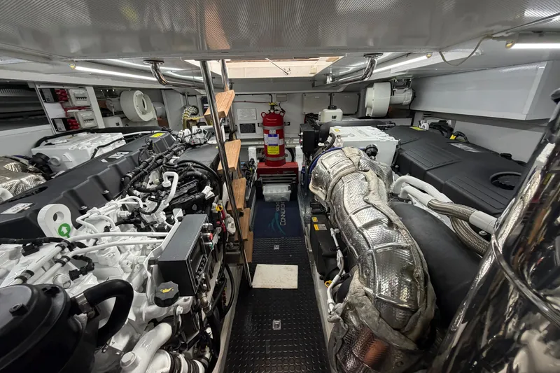 Slide: The Image of Engine room of a 2020 Horizon E56 yacht, showcasing advanced machinery and equipment. - 101
