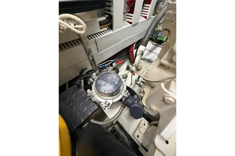 Slide: The Image of Engine room of a 2020 Horizon E56 yacht, showcasing mechanical components and wiring. - 100