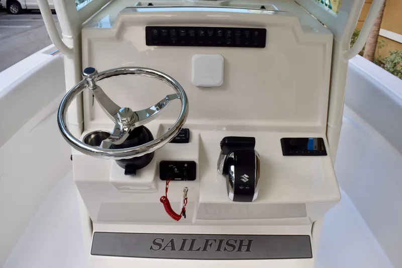 Slide: The Image of 2026 Sailfish 232 CC boat console with steering wheel and controls. - 6
