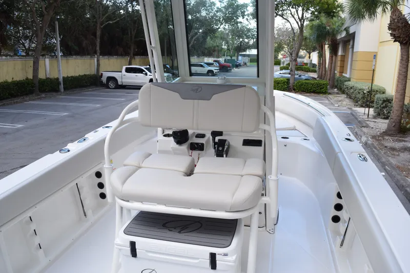 Slide: The Image of 2026 Sailfish 232 CC boat interior with white seating and modern controls. - 10