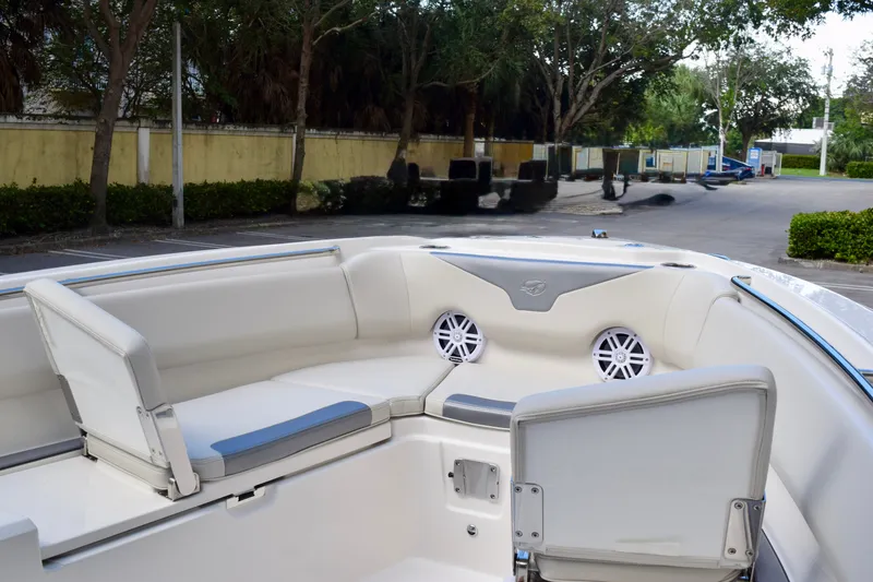 Slide: The Image of 2026 Sailfish 232 CC boat interior with cushioned seating and speakers. - 5