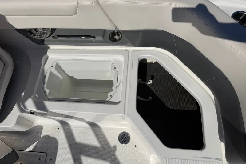 Slide: The Image of Interior storage compartments of a 2016 Chaparral 250 Suncoast boat. - 24