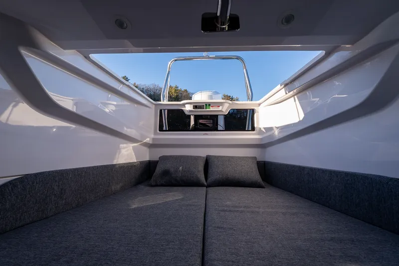 Slide: The Image of Interior view of 2026 Axopar 29 XC Cross Cabin, featuring a cozy cabin bed. - 35