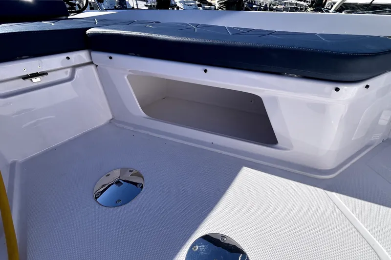 Slide: The Image of 2026 Axopar 29 XC Cross Cabin interior seating and storage area. - 33