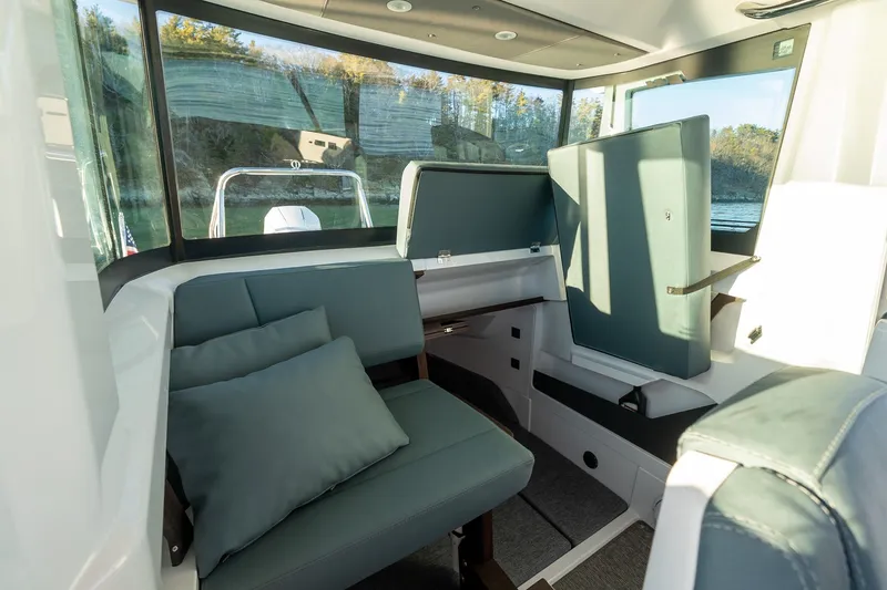 Slide: The Image of Interior of 2026 Axopar 29 XC Cross Cabin with modern seating and large windows. - 26