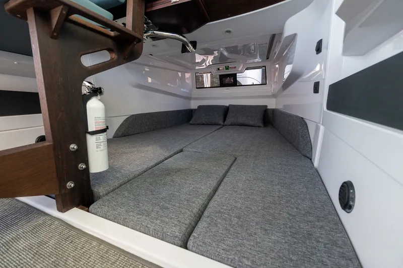 Slide: The Image of Cozy interior cabin of 2026 Axopar 29 XC Cross Cabin with gray cushions. - 33