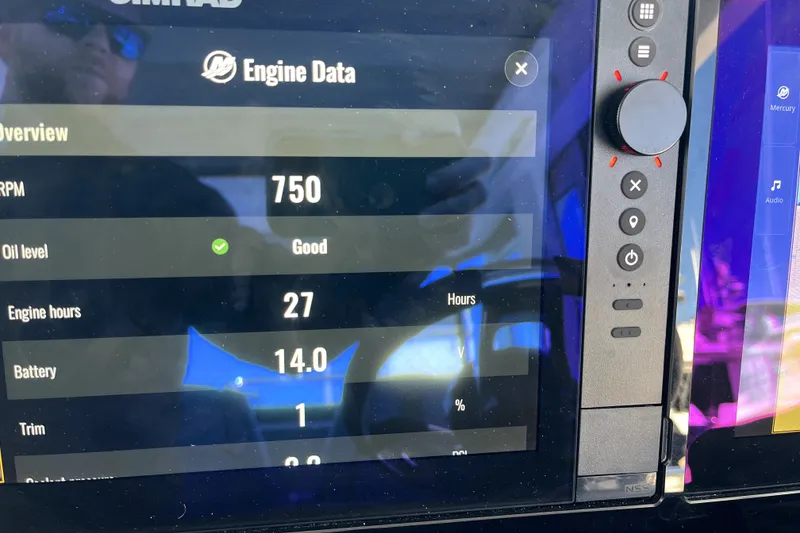 Slide: The Image of Engine data display on 2026 Axopar 29 XC Cross Cabin showing RPM, oil level, and battery status. - 40