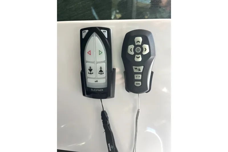 Slide: The Image of Remote controls for 2026 Axopar 29 XC Cross Cabin boat, featuring navigation and anchor functions. - 24
