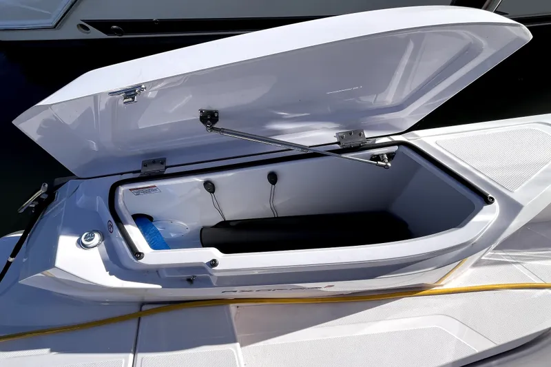Slide: The Image of Open storage compartment on 2026 Axopar 29 XC Cross Cabin boat. - 37