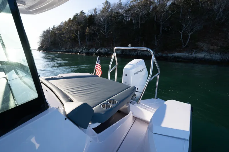 Slide: The Image of 2026 Axopar 29 XC Cross Cabin boat with Mercury engine on calm water. - 19