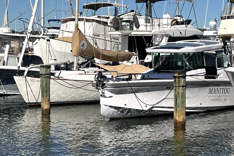 Slide: The Image of 2026 Axopar 29 XC Cross Cabin boat docked in marina, Annapolis, MD. - 1