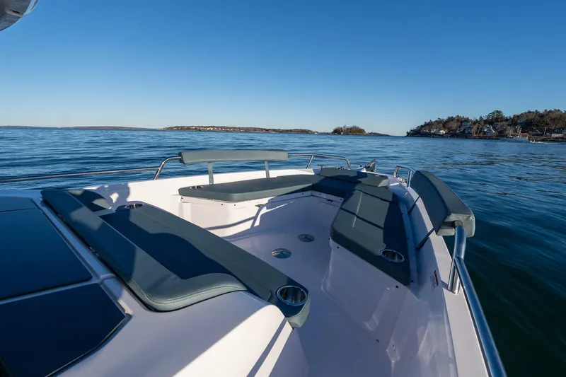 Slide: The Image of 2026 Axopar 29 XC Cross Cabin boat on calm waters, featuring spacious seating and sleek design. - 10