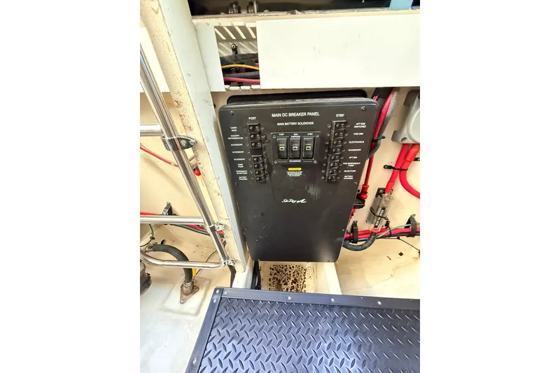 Slide: The Image of Electrical panel of a 2008 Sea Ray 340 Sundancer boat, featuring various switches and wiring. - 40