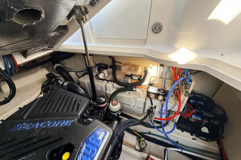 Slide: The Image of Engine compartment of a 2008 Sea Ray 340 Sundancer with visible wiring and components. - 37
