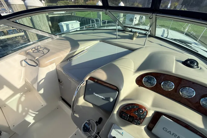 Slide: The Image of 2008 Sea Ray 340 Sundancer cockpit with navigation instruments and steering wheel. - 20