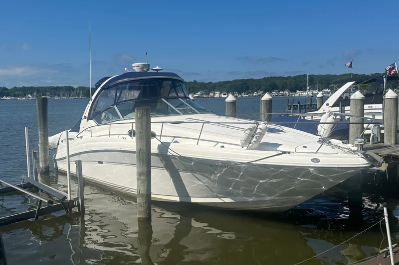 The Image of 2008 Sea Ray 340 Sundancer docked at a marina on a sunny day. - 0